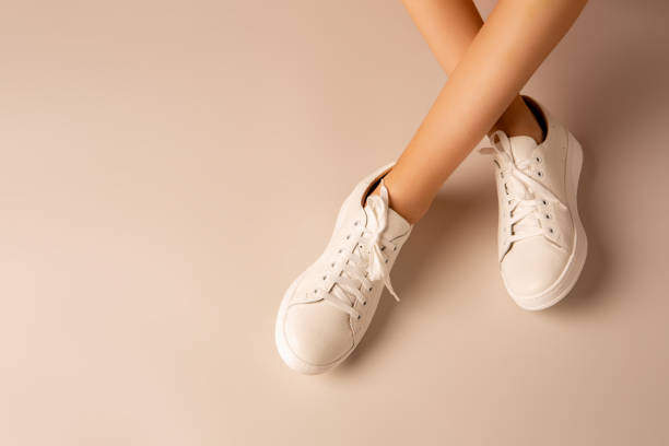 Stylish white sneakers paired with a floral summer dress