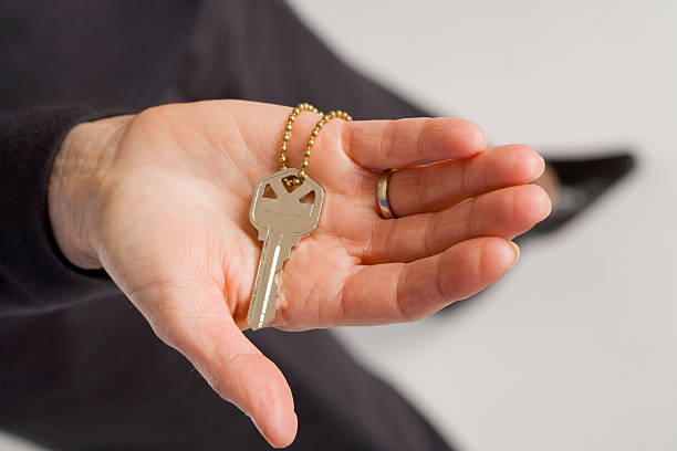 Woman wearing a key necklace as a symbol of trust and love